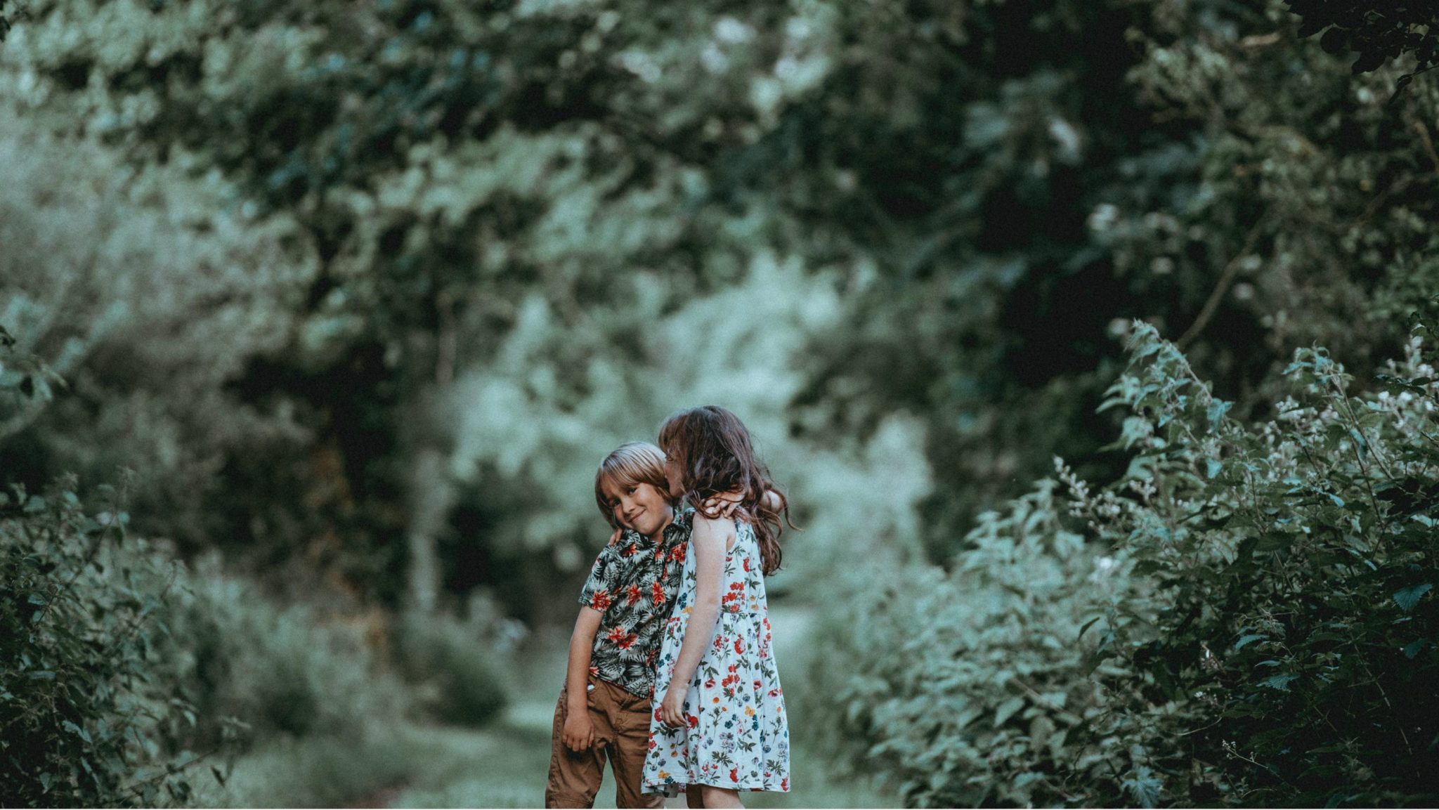 children outside hugging