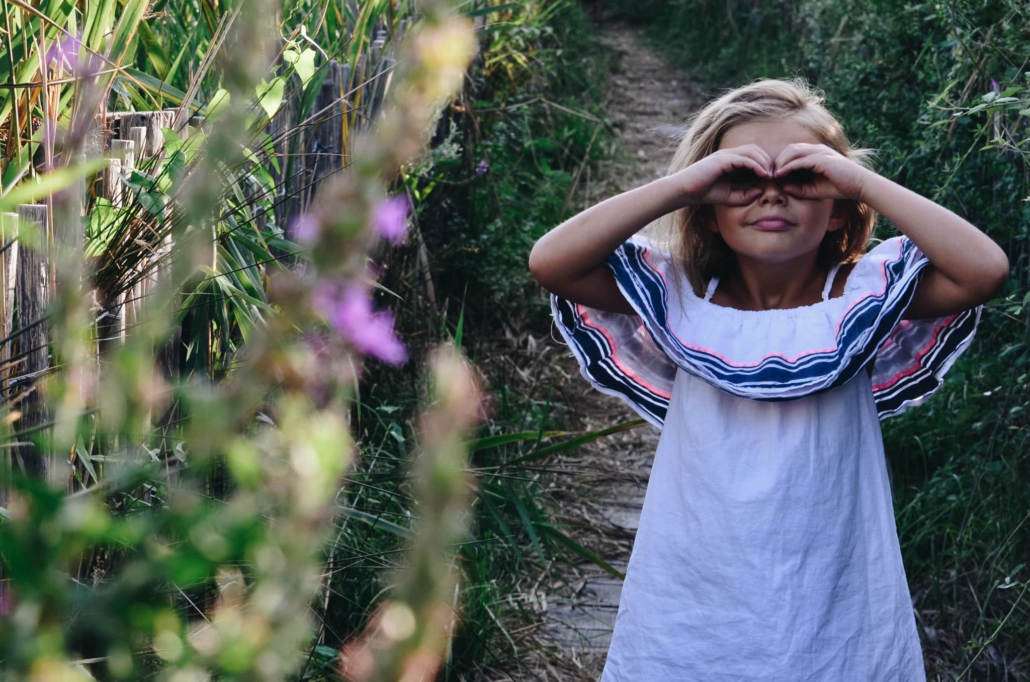 girl making mask outside