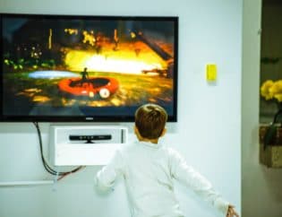 child in front of screen