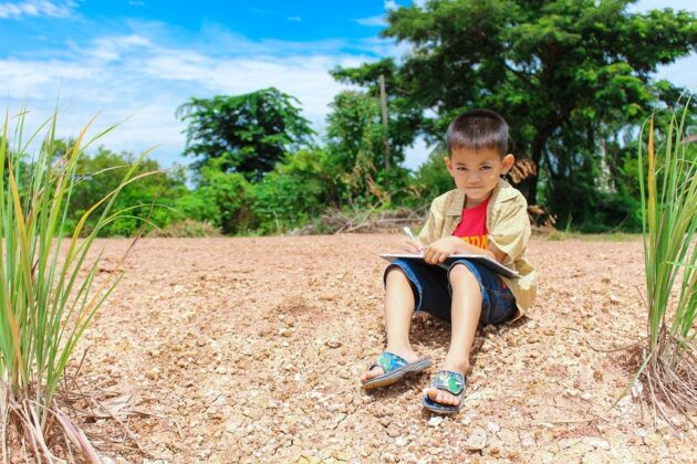 child learning outdoors