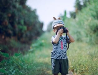 little boy taking video