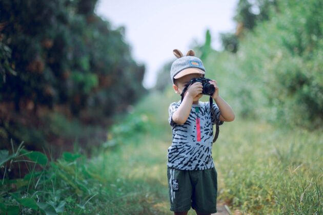 little boy taking video