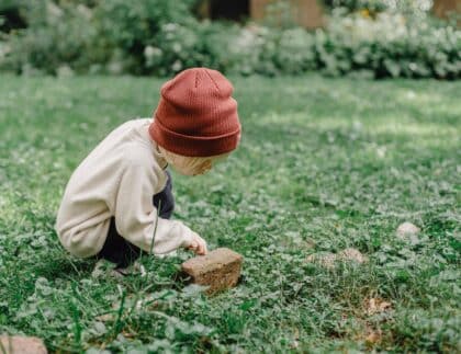 child exploring nature