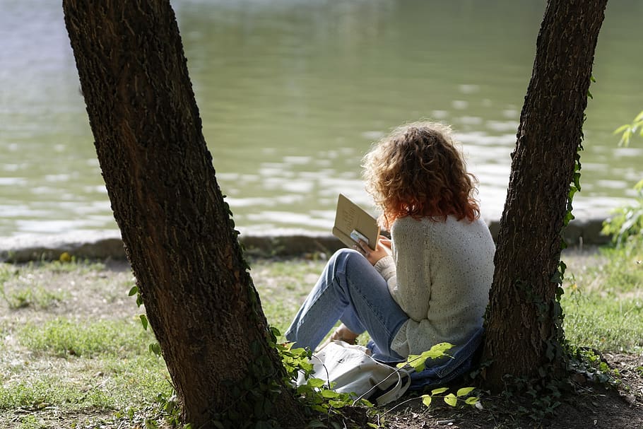 girl reading outside